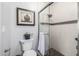 Bathroom features framed art, modern toilet, glass shower door and tiled shower at 6112 E Jenan Dr, Scottsdale, AZ 85254