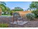 Community park bench with a shaded seat and desert landscaping at 6112 E Jenan Dr, Scottsdale, AZ 85254