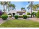 Charming single-story home boasts a lush green lawn and manicured landscaping, enhancing curb appeal at 6112 E Jenan Dr, Scottsdale, AZ 85254