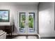 Bright room featuring double doors that offers seamless transition to outdoor living spaces at 6112 E Jenan Dr, Scottsdale, AZ 85254