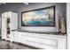 Stylish wet bar area with white cabinets, granite countertops, and statement artwork at 6112 E Jenan Dr, Scottsdale, AZ 85254