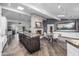 Spacious kitchen and dining area features a stone fireplace and gourmet island at 6112 E Jenan Dr, Scottsdale, AZ 85254