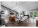 Spacious living room with abundant natural light, vaulted ceilings and beautiful wood floors at 6112 E Jenan Dr, Scottsdale, AZ 85254