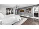 Spacious main bedroom featuring unique artwork, a ceiling fan, and an ensuite bathroom at 6112 E Jenan Dr, Scottsdale, AZ 85254