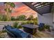 Inviting outdoor patio with comfortable seating and a fire pit, perfect for entertaining or relaxation at 6112 E Jenan Dr, Scottsdale, AZ 85254