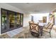 Welcoming covered patio showcasing stone floors and dining set, perfect for outdoor entertaining at 6112 E Jenan Dr, Scottsdale, AZ 85254