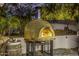 Outdoor pizza oven made of decorative tile, offering ambiance and a unique culinary experience at 6112 E Jenan Dr, Scottsdale, AZ 85254