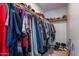 Walk-in closet with clothing rack and upper shelf in bedroom at 6311 E Ivy St, Mesa, AZ 85205