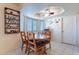 Charming dining area featuring wooden dining table and lots of bright natural light at 6311 E Ivy St, Mesa, AZ 85205