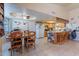 Bright dining room with wooden dining table and a seamless flow into the kitchen at 6311 E Ivy St, Mesa, AZ 85205