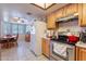 A cozy kitchen features stainless steel appliances, light cabinets, and tile flooring at 6311 E Ivy St, Mesa, AZ 85205