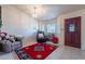 Inviting living room featuring tile floors, natural lighting, and a comfortable seating arrangement at 6311 E Ivy St, Mesa, AZ 85205
