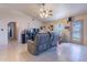Relaxing living room with cozy seating and access to backyard, offering a seamless indoor-outdoor living experience at 6311 E Ivy St, Mesa, AZ 85205