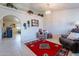 Open-concept living room showcasing an archway, tile flooring, and a cozy seating arrangement with decor at 6311 E Ivy St, Mesa, AZ 85205