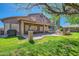 Expansive backyard with a covered patio, second story deck, and a cozy fire pit area at 6350 S Four Peaks Pl, Chandler, AZ 85249