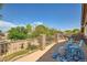 Relaxing balcony boasts comfortable seating with views of lush greenery and blue skies at 6350 S Four Peaks Pl, Chandler, AZ 85249