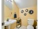 Cozy powder room featuring a pedestal sink and decorative wall decor at 6350 S Four Peaks Pl, Chandler, AZ 85249