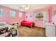 Pink-themed ' bedroom with polka dot walls and two twin beds at 6350 S Four Peaks Pl, Chandler, AZ 85249