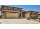 Spacious home boasts a two-car garage and inviting curb appeal with an extra parking space at 6350 S Four Peaks Pl, Chandler, AZ 85249
