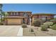 Charming two-story home featuring a two-car garage and a well-manicured front yard at 6350 S Four Peaks Pl, Chandler, AZ 85249