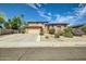 Charming two-story home featuring a well-manicured yard and a spacious two-car garage at 6350 S Four Peaks Pl, Chandler, AZ 85249