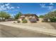 An inviting home with desert landscaping and a view of the side entry at 6350 S Four Peaks Pl, Chandler, AZ 85249
