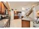 Bright and open kitchen with stainless steel appliances and ample countertop space at 6350 S Four Peaks Pl, Chandler, AZ 85249
