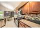 Well-appointed kitchen with stainless steel appliances, tile backsplash, and a breakfast nook at 6350 S Four Peaks Pl, Chandler, AZ 85249