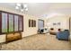 Spacious living room with carpet, shuttered windows, and comfortable seating at 6350 S Four Peaks Pl, Chandler, AZ 85249