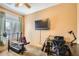 Functional office space with a desk, guitar, and workout equipment at 6350 S Four Peaks Pl, Chandler, AZ 85249