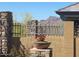 Landscaped desert view, including brick wall and wrought iron fence at 6912 E Quill St, Mesa, AZ 85207