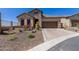 Charming single-Gathering home with stone accents, desert landscaping, and a paved driveway at 6912 E Quill St, Mesa, AZ 85207