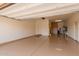 Spacious two car garage featuring epoxy floors and ample storage at 6912 E Quill St, Mesa, AZ 85207