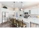 Bright and spacious kitchen features a large island, stainless steel appliances, and modern white cabinets at 6912 E Quill St, Mesa, AZ 85207