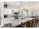 Modern kitchen featuring granite countertops, stainless appliances, and a view to the outdoor spaces at 6912 E Quill St, Mesa, AZ 85207