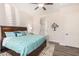 Inviting main bedroom with a king bed, neutral colors, plantation shutters, and ample natural light at 6912 E Quill St, Mesa, AZ 85207