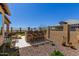 Outdoor covered bar area with seating provides a perfect spot for entertaining and relaxing in the backyard at 6912 E Quill St, Mesa, AZ 85207