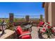 Cozy outdoor patio area with stone accents and comfortable seating at 6912 E Quill St, Mesa, AZ 85207