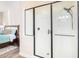 Glass enclosed walk-in shower offering a modern look, a rain shower head, and designer fixtures at 6912 E Quill St, Mesa, AZ 85207