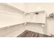 Spacious walk-in closet featuring ample shelving and hanging storage space at 6912 E Quill St, Mesa, AZ 85207