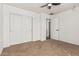 A minimalist bedroom featuring a closet and an open doorway for easy access and flow at 7090 S 252 Dr, Buckeye, AZ 85326