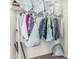 A well-organized closet, with clothes and accessories neatly arranged, maximizing storage space at 7090 S 252 Dr, Buckeye, AZ 85326