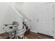 Bright stairway with wood flooring and a motorized chair for easy access at 7090 S 252 Dr, Buckeye, AZ 85326