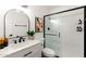 Bright bathroom featuring a modern vanity and a glass-enclosed shower with matte black fixtures at 7350 N Via Paseo Del Sur -- # P105, Scottsdale, AZ 85258