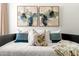 Well-lit bedroom with decorative pillows, modern art and a comfortable bed at 7350 N Via Paseo Del Sur -- # P105, Scottsdale, AZ 85258