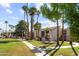 Beautiful condo exterior with green lawn, mature trees and water fountain feature at 7350 N Via Paseo Del Sur -- # P105, Scottsdale, AZ 85258