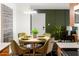 Dining room with modern table setting, stylish chairs, and contemporary light fixture at 7350 N Via Paseo Del Sur -- # P105, Scottsdale, AZ 85258