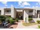 Exterior view of the building featuring well-maintained landscaping, walkways, and architectural details at 7350 N Via Paseo Del Sur -- # P105, Scottsdale, AZ 85258