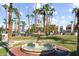 Beautiful fountain surrounded by palm trees and well-manicured lawns in a community setting at 7350 N Via Paseo Del Sur -- # P105, Scottsdale, AZ 85258