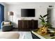 Relaxing living room featuring a mounted flat screen, modern furniture, and stylish decor at 7350 N Via Paseo Del Sur -- # P105, Scottsdale, AZ 85258